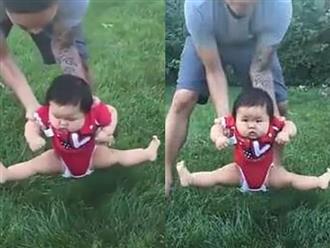 Bố định đặt con xuống bãi cỏ chơi, phản ứng của cô bé khiến ai nấy cười lăn cười bò